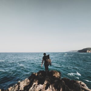 man standing on the cliff